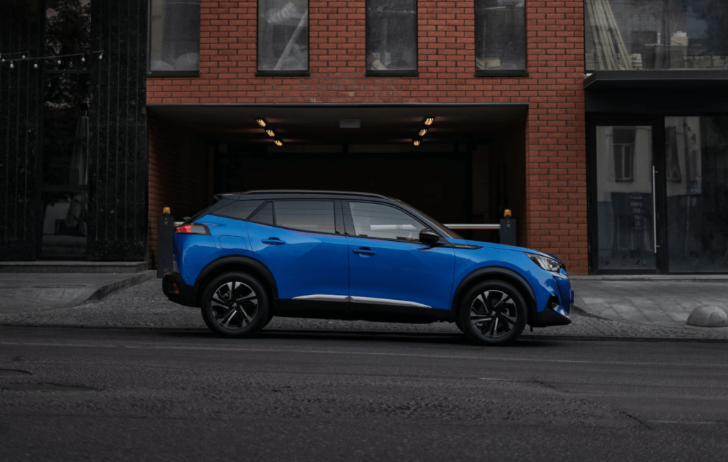 Blue Peugeot in the city
