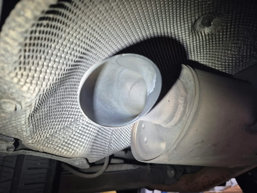 Clean exhaust tip on a Mercedes GLC 220 d after the AdBlue system repair, free of urea crystal deposits